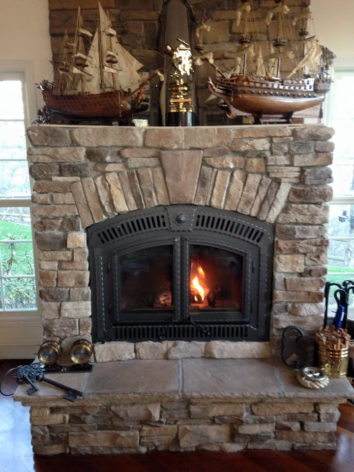 fireplace in home with double doors