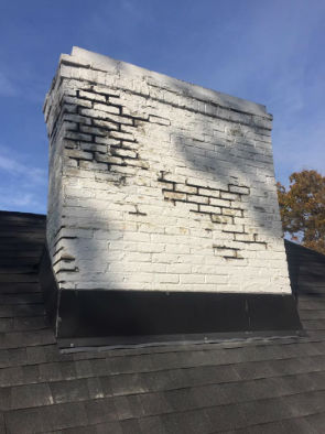 white chimney on rood with flashing