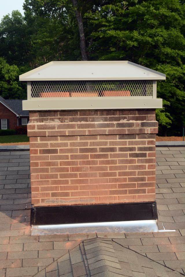 chimney with cap on roof