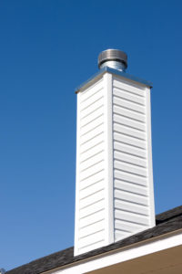 prefabricated chimney against blue sky