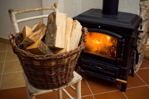 fireplace with basket of wood